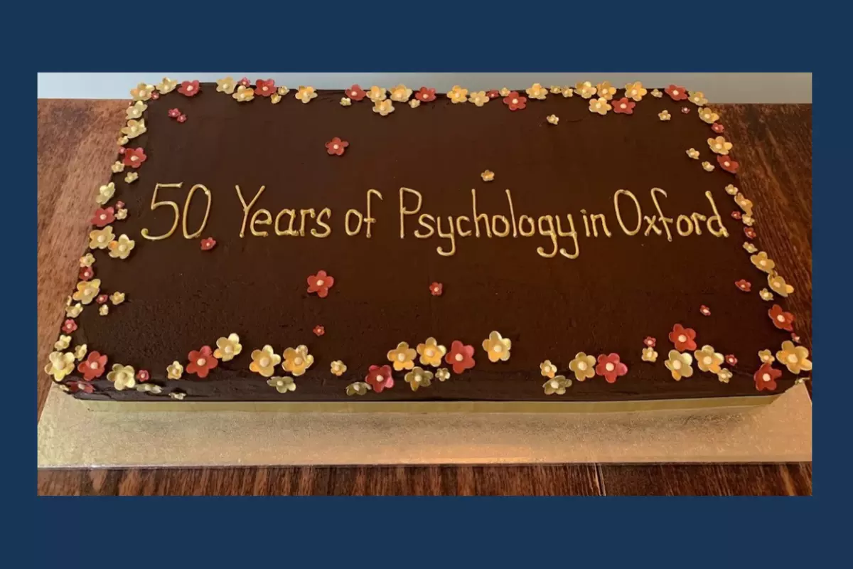 Photograph of a birthday cake with '50 Years of Psychology in Oxford' written in icing