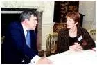 julie mellor sitting at a table with Gordon Brown