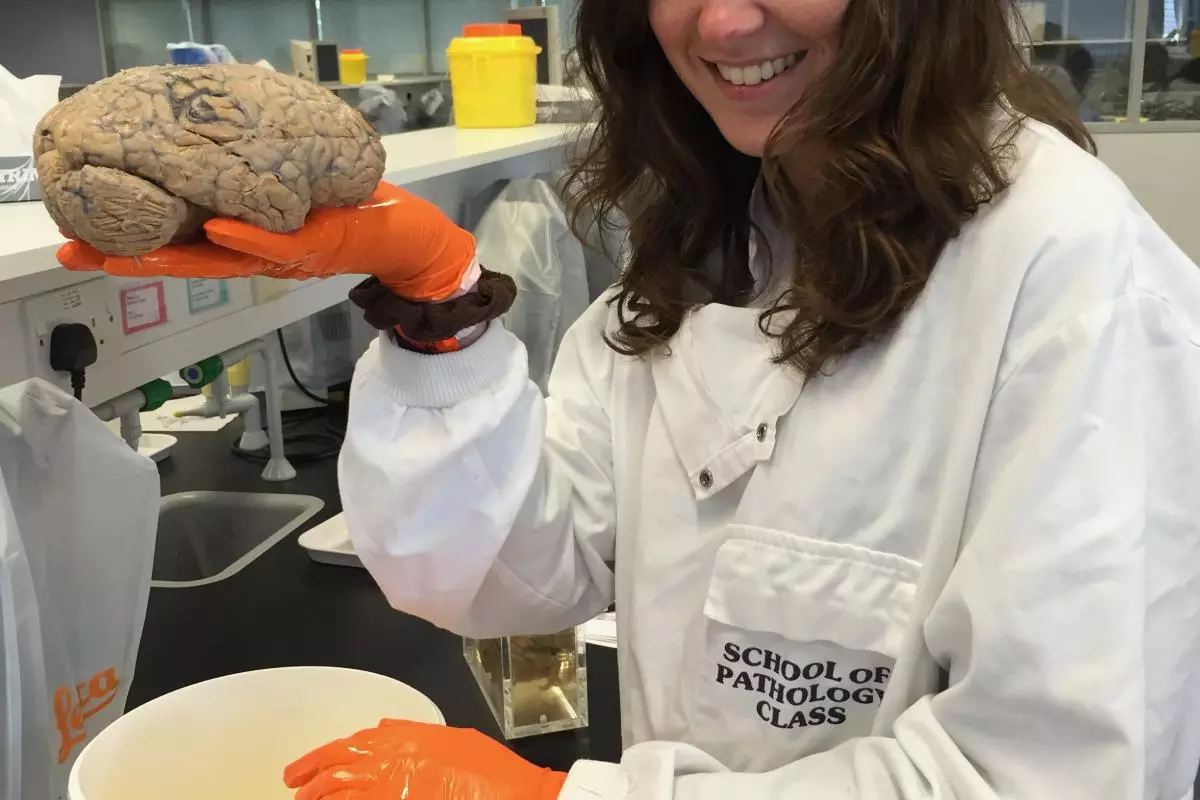 Woodward Natalie in the lab holding brain