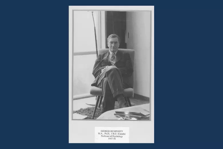 Black and white photo of george humphrey sitting in front of a window